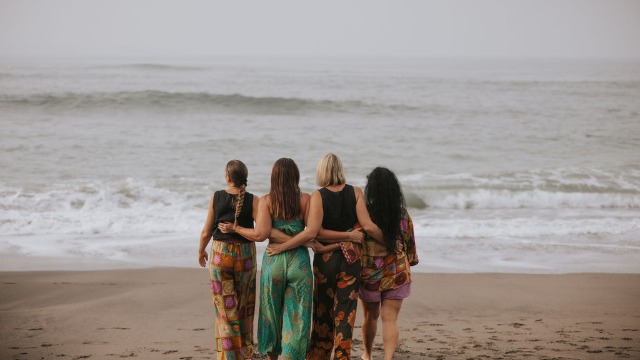 Women Walking On The Beach